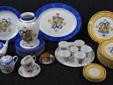 many plates and cups that are sitting on a table