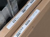 two cardboard boxes sitting on top of each other