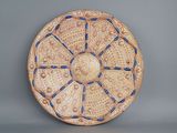 an image of a decorative plate with blue and white designs
