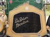 a close up of an old fashioned car with the name belin boston on it