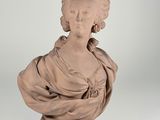 statue of a woman with a shaw around her neck