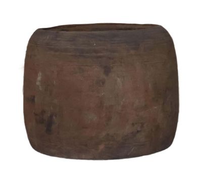 a large brown pot sitting on top of a table