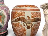 several vases and a statue are sitting on a white surface