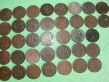 a close up of a pile of coins on a green surface