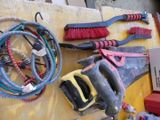 many tools hanging on the wall next to each other