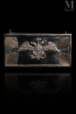 a close up of a metal box with a bird on it