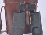 two binoculars sitting next to each other on a white surface