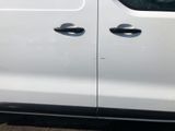 a white van that has two holes in the side of it
