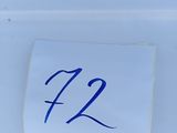 a close up of a piece of paper with the number 72 on it