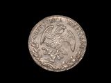 a close up of a silver coin with an eagle on it