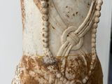 a statue of a woman with a necklace on it ' s neck
