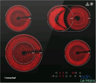 une image représentant une plaque de cuisson noire et rouge équipée de quatre feux