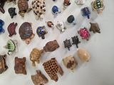 a lot of small figurines that are on the table