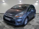 a picture of a blue citrole car parked in a garage