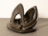 statue of a bird on a plate on a table