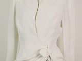 an image of a white jacket on a mannequin