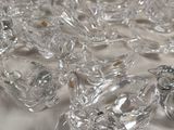 many clear glass figurines sitting on a table