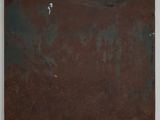 an abstract painting of rusted metal on a white wall