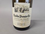 a bottle of wine that is sitting on a table