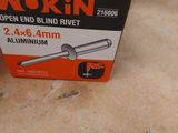 a box of nokin brand rivets on the floor