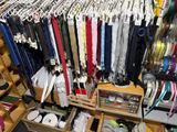 a closet full of different types of ties and other items