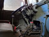 an old military vehicle with a steering wheel and a seat