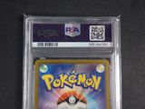 a close up of a pokemon card on a table