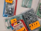 many different types of screws and screws on the table