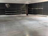 a large empty room with a lot of shelves on the wall