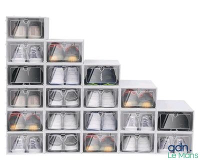 a stack of clear plastic boxes with shoes in them