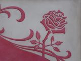 a rose that is on the side of a building