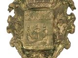 a gold plate with a coat of arms on it