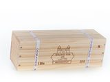 the wooden box has a label on it and a ribbon around it