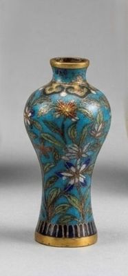 two vases sitting next to each other on a table
