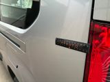a van that has a sticker on the back of it