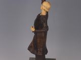 statue of a woman with a bird on her hand