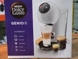 packaging of a coffee machine sitting on top of a wooden table