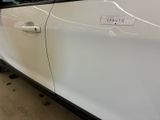a sticker on the door of a white car
