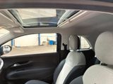 the interior of a car with the sunroof down and a view of the back seats