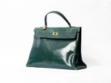 vintage green leather handbag with gold hardware