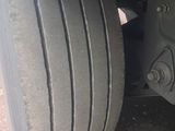 a close up view of a tire on a truck