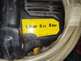 a close up of a hose with a yellow tag on it