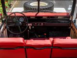 a red and black car with a steering wheel and red seats