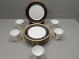 a lot of cups and a plate on the table
