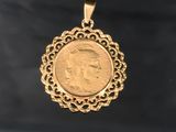 a close up of a gold coin with a woman ' s face on it
