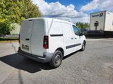 a white van that is parked in the parking lot