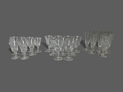 six wine glasses sitting next to each other on a table
