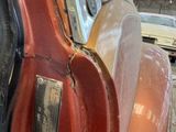 a close up of an old car in a garage