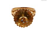 une image d'une bague sertie d'une citrine facettée