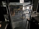 an image of a kitchen with an oven in the middle of the room